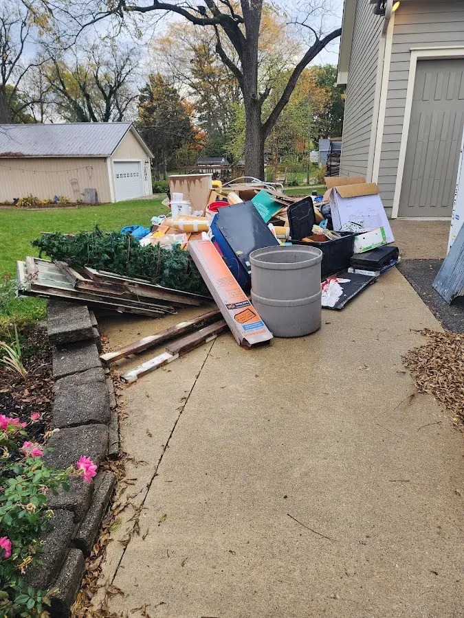 Dumpster being loaded with debris for Demolition Dumpster Rental in Cottondale